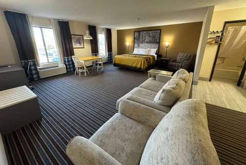 Suite, 1 King Bed | Desk, laptop workspace, blackout drapes, free WiFi