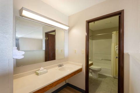 Suite, 2 Queen Beds, Non Smoking | Bathroom | Combined shower/tub, hair dryer, towels