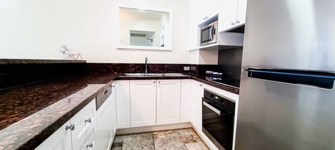 Two Bedroom Deluxe | Private kitchen | Full-size fridge, microwave, oven, stovetop