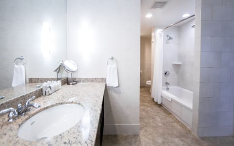 Deluxe Suite, 1 Bedroom | Bathroom | Combined shower/tub, free toiletries, hair dryer, towels