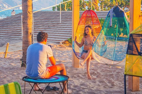 On the beach, beach towels, beach volleyball, kayaking