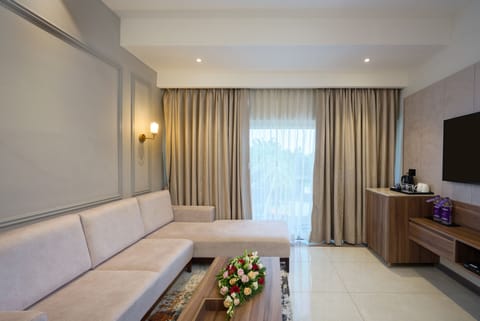 Flora Suite with complimentary airport transfers | Living area | 32-inch LCD TV with satellite channels, TV, table tennis