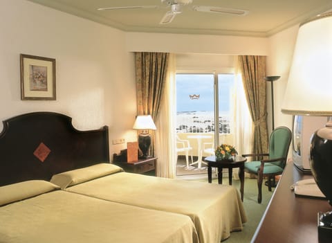 Double Room, Partial Sea View | In-room safe, bed sheets