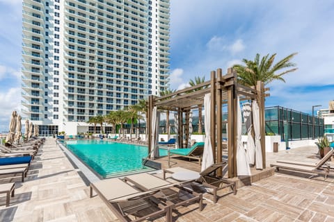 Outdoor pool, pool umbrellas, sun loungers