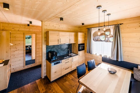 Chalet, 2 Bedrooms | Living area | TV, heated floors