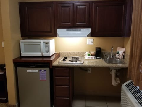 Fridge, microwave, stovetop, cookware/dishes/utensils