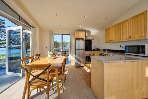 Deluxe Apartment, 2 Bedrooms, Ocean View | Private kitchen | Coffee/tea maker, electric kettle, toaster, highchair