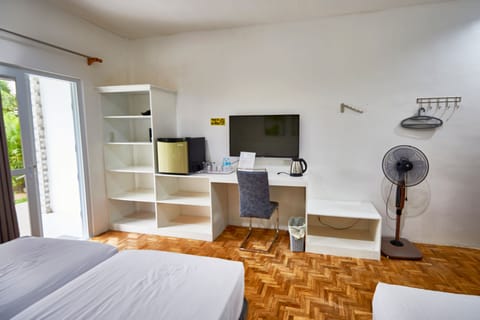 Superior Triple Room, Pool View | Minibar, in-room safe, desk, laptop workspace