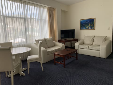 Executive Apartment, 1 Bedroom | Living area | 45-inch TV with cable channels