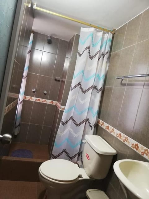 Shower, rainfall showerhead, towels, soap