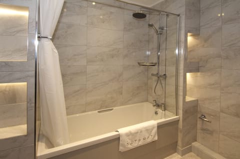 Combined shower/tub, free toiletries, hair dryer, bathrobes