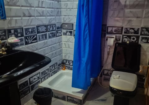 Economy Studio | Bathroom | Shower, hair dryer, slippers, heated floors