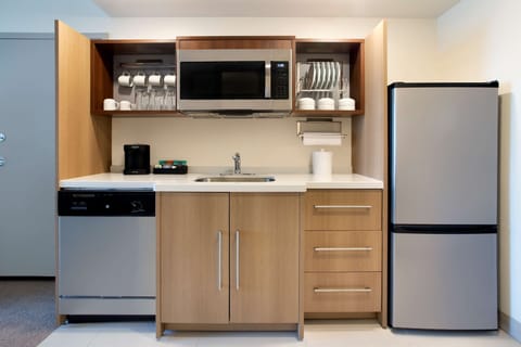 Mini-fridge, microwave, coffee/tea maker, paper towels