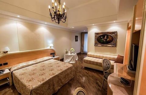 Standard Triple Room | Minibar, in-room safe, desk, laptop workspace