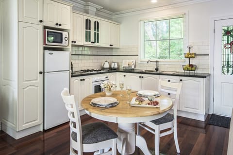 Keepers Cottage | Private kitchen | Full-size fridge, microwave, stovetop, coffee/tea maker