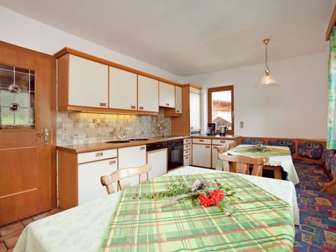 Apartment | Private kitchen | Stovetop, coffee/tea maker, highchair