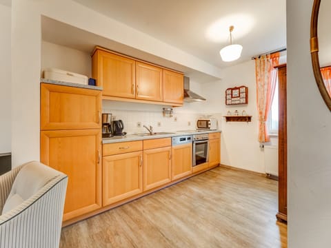 Apartment | Private kitchen | Fridge, highchair
