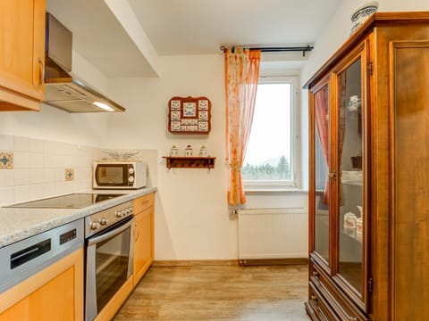 Apartment | Private kitchen | Fridge, highchair