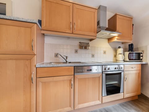 Apartment | Private kitchen | Fridge, coffee/tea maker, highchair
