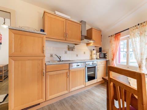 Apartment | Private kitchen | Fridge, coffee/tea maker, highchair