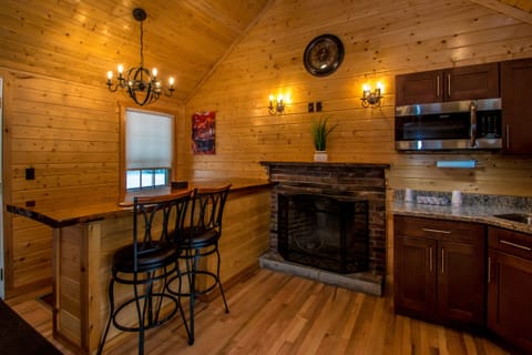 Deluxe Cabin | Private kitchen | Microwave, coffee/tea maker, dining tables