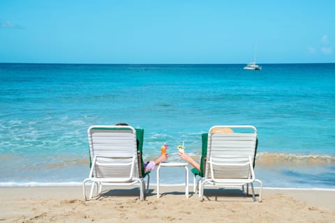 On the beach, white sand, sun loungers, scuba diving