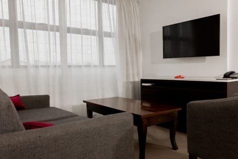 Two-Bedroom Apartment | Living area | 42-inch Smart TV with satellite channels, TV