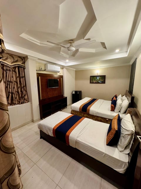 Executive Triple Room, Multiple Beds, Refrigerator, Ground Floor | Premium bedding, down comforters, soundproofing, free WiFi