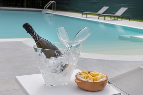 Seasonal outdoor pool, open 8:30 AM to 8:00 PM, sun loungers