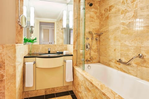 Combined shower/tub, designer toiletries, hair dryer, slippers