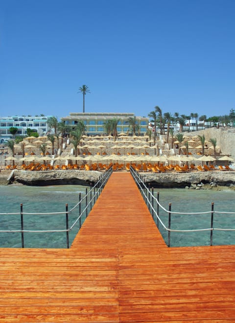 Private beach, white sand, sun loungers, beach umbrellas