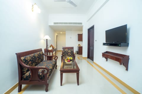 Luxury Suite, 1 King Bed | Living room | LCD TV