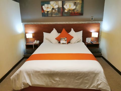 Junior Suite | Down comforters, in-room safe, individually decorated, desk