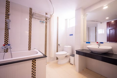 Deluxe Room | Bathroom | Designer toiletries, hair dryer, towels, soap