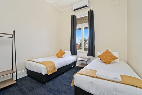 Twin Room, 2 Twin Beds, Shared Bathroom | Free WiFi, bed sheets