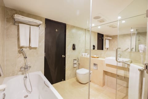 Suite, 1 King Bed, Non Smoking | Bathroom | Separate tub and shower, rainfall showerhead, free toiletries