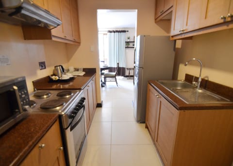 Suite, 2 Bedrooms | Private kitchenette | Fridge, microwave, oven, stovetop