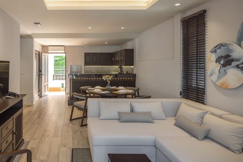 Suite, 2 Bedrooms | Living area | 32-inch LCD TV with cable channels, TV