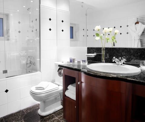 Bathtub, eco-friendly toiletries, hair dryer, towels