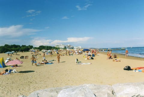 Beach nearby, white sand, beach umbrellas