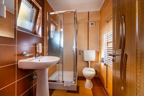 Superior Family Room  | Bathroom | Shower, free toiletries, hair dryer, slippers