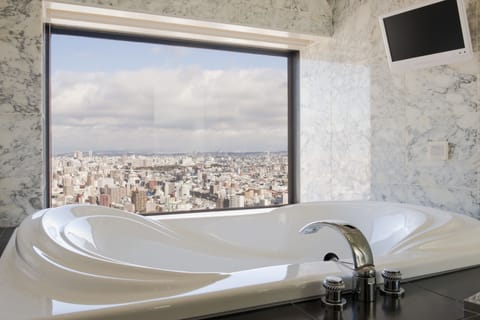 Suite, 1 Bedroom, City View (High Floor, Nagoya City View) | Bathroom | Bathtub, free toiletries, hair dryer, slippers