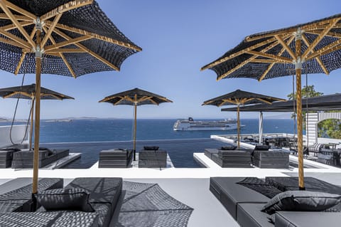 Outdoor pool, pool umbrellas, sun loungers