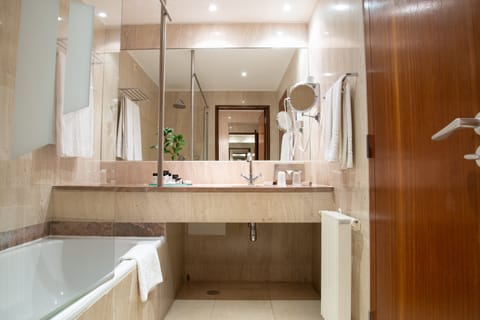 Bathtub, deep soaking tub, eco-friendly toiletries, hair dryer