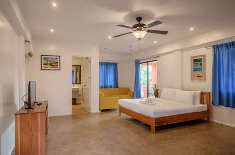 Family Room, Sea View, 1 Bedroom | Minibar, in-room safe, individually decorated, individually furnished