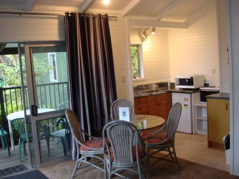 Deluxe Cottage, 2 Bedrooms, Garden View, Poolside | Living area | 40-inch Smart TV with satellite channels, TV, Netflix