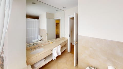 Suite, Garden View | Bathroom | Combined shower/tub, deep soaking tub, rainfall showerhead