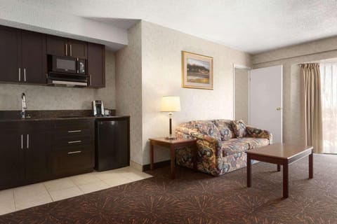 Suite, 1 King Bed, Smoking | Pillowtop beds, desk, blackout drapes, iron/ironing board