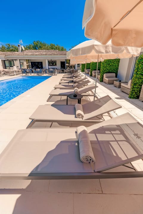 Outdoor pool, open 10:00 AM to 8:00 PM, pool umbrellas, sun loungers