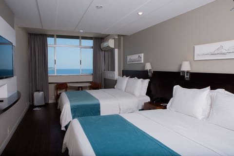 Family Room, Beach View | Pillowtop beds, minibar, in-room safe, individually decorated